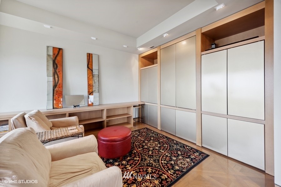 1301 Spring Street, Unit 30J Seattle, WA 98104 - Photo 11 of 40 a living room with furniture