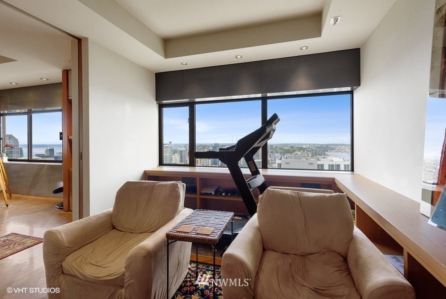1301 Spring Street, Unit 30J Seattle, WA 98104 - Photo 12 of 40 a living room with furniture and a window