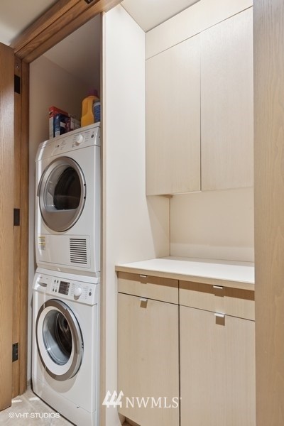 1301 Spring Street, Unit 30J Seattle, WA 98104 - Photo 19 of 40 a utility room with dryer and washer
