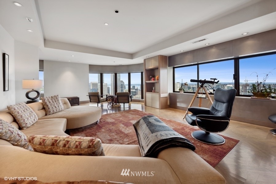 1301 Spring Street, Unit 30J Seattle, WA 98104 - Photo 2 of 40 a living room with furniture and a couch