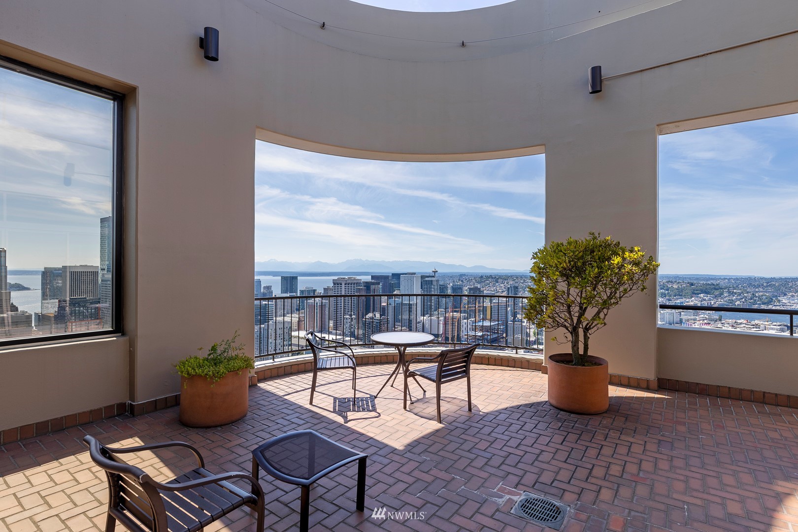 1301 Spring Street, Unit 30J Seattle, WA 98104 - Photo 28 of 40 a living room with furniture flowerpot and a window