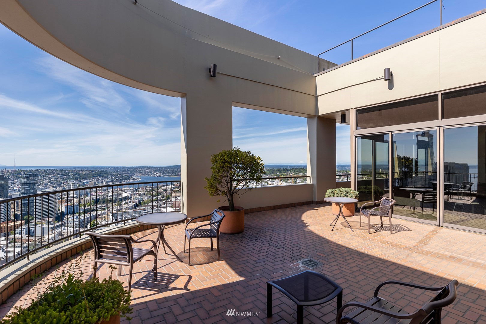 1301 Spring Street, Unit 30J Seattle, WA 98104 - Photo 29 of 40 a outdoor space with patio the couches and a potted plant