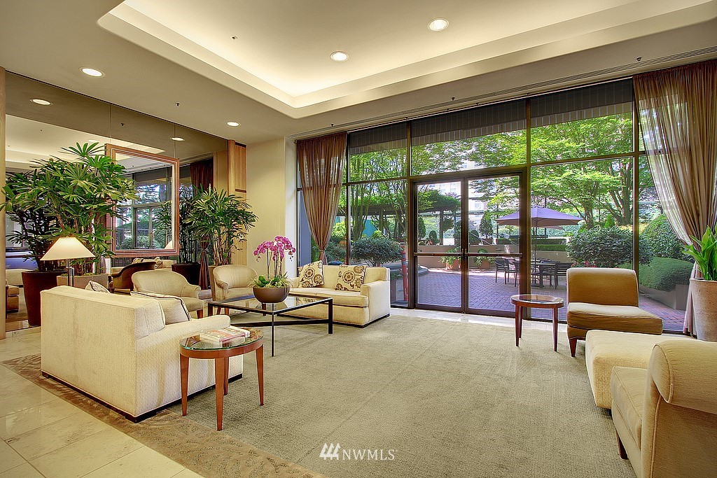 1301 Spring Street, Unit 30J Seattle, WA 98104 - Photo 30 of 40 a living room with furniture and a large window