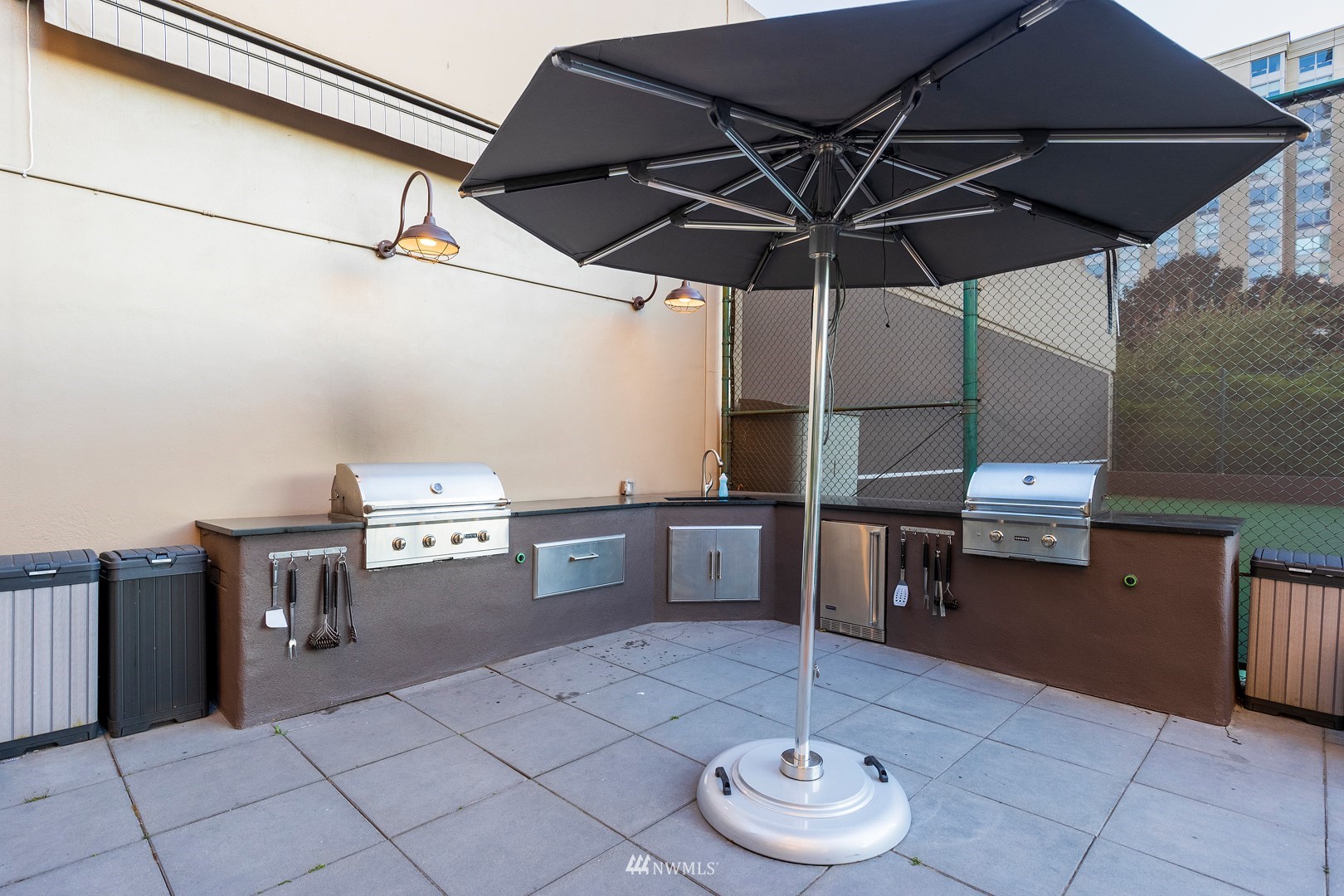1301 Spring Street, Unit 30J Seattle, WA 98104 - Photo 36 of 40 a kitchen with a table and chairs