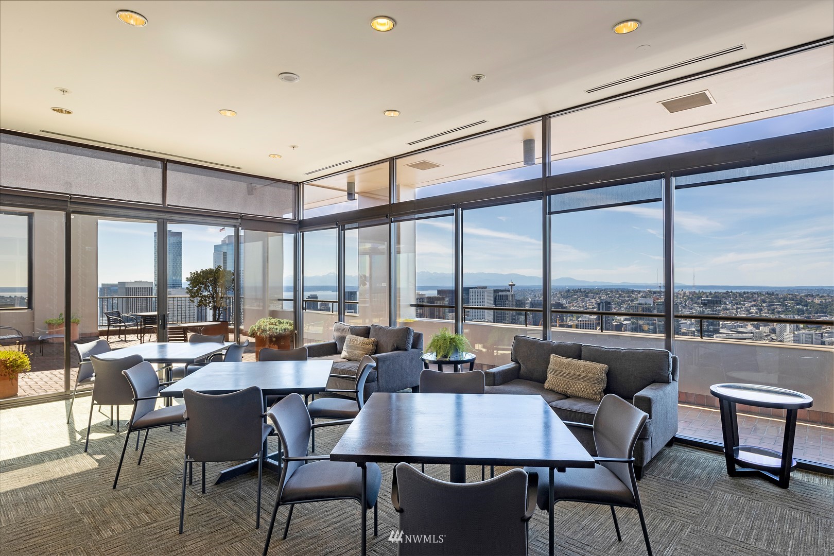 1301 Spring Street, Unit 30J Seattle, WA 98104 - Photo 38 of 40 a view of a dining room with furniture and window