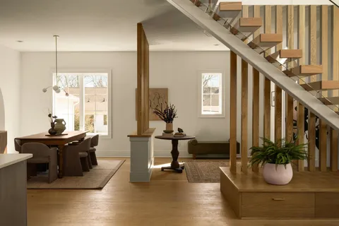 a view of a dining room with furniture and window