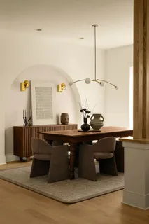 a kitchen with a stove a sink and cabinets