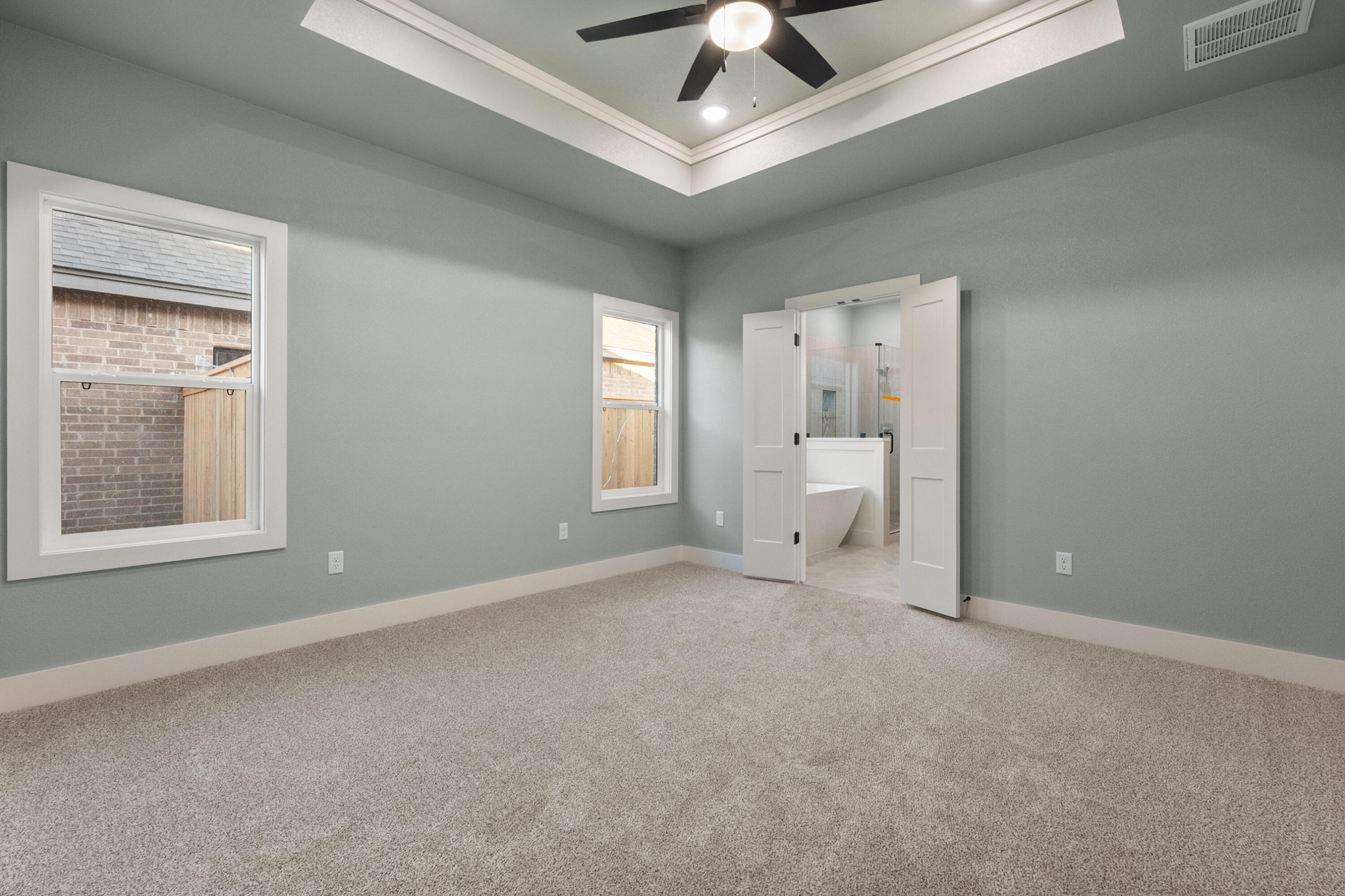 1121 North 6th Street Wolfforth, TX 79382 - Photo 17 of 31 a view of an empty room with a window and a ceiling fan