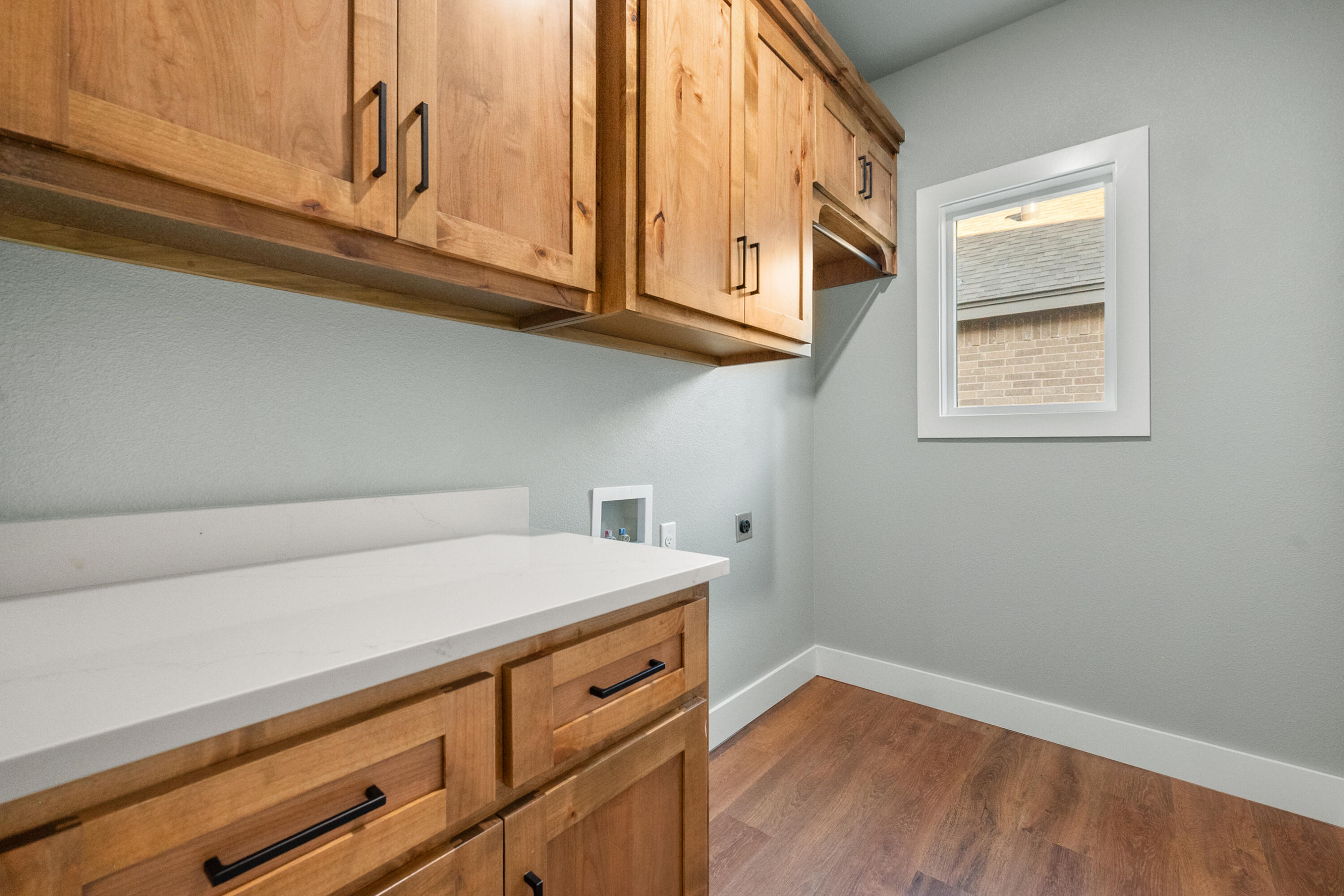 1121 North 6th Street Wolfforth, TX 79382 - Photo 27 of 31 a kitchen with stainless steel appliances cabinets a stove and a window