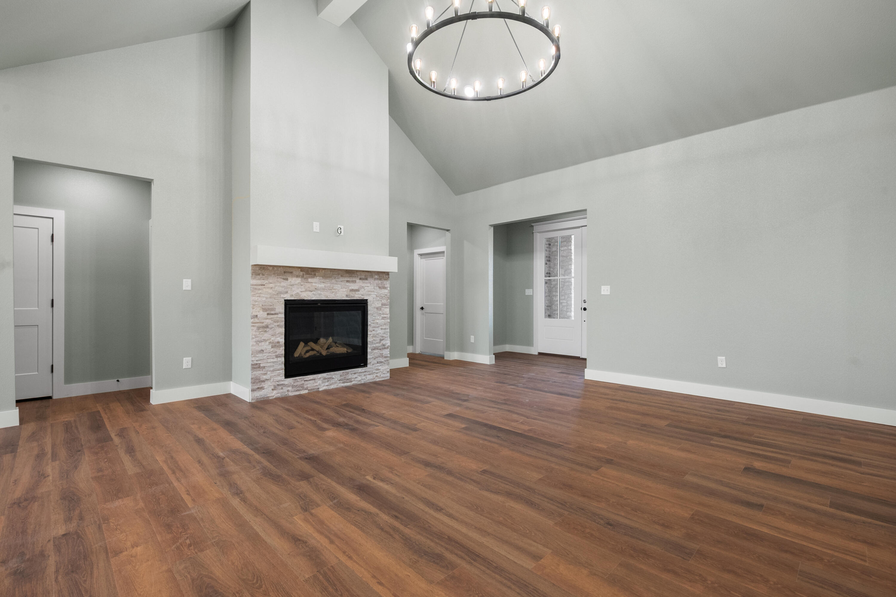 1121 North 6th Street Wolfforth, TX 79382 - Photo 8 of 31 a view of empty room with wooden floor and fireplace