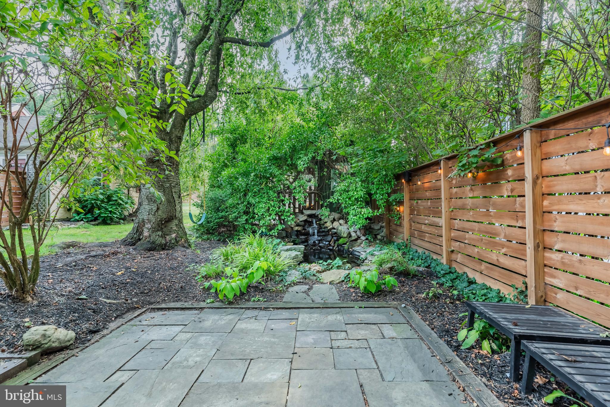 710 Fishburn Road Hershey, PA 17033 - Photo 13 of 49 Paver Patio Overlooks Waterfall/Pond