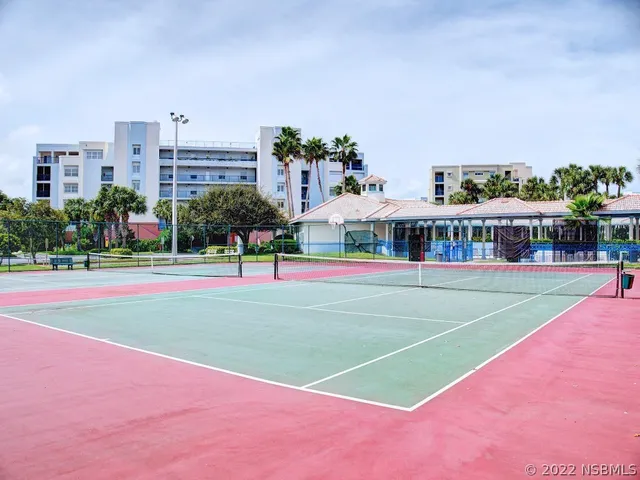 a view of house with swimming pool and porch
