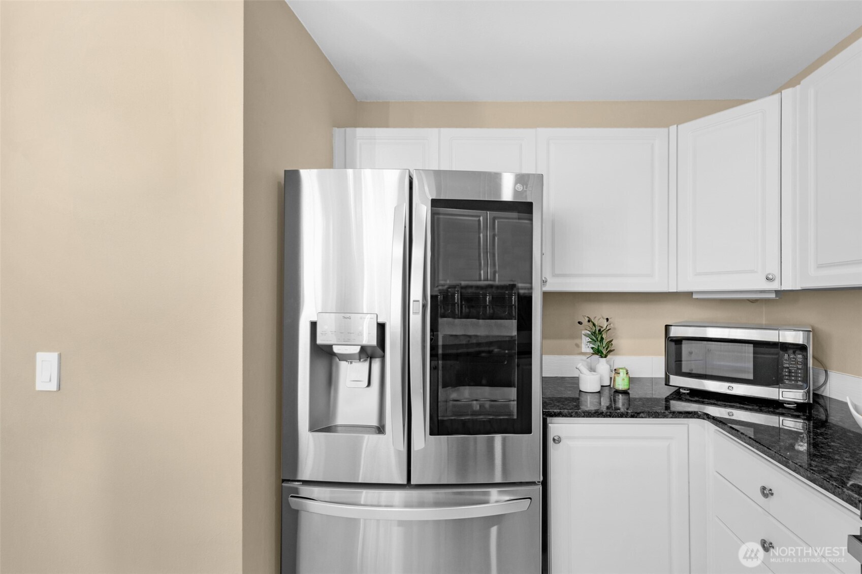 14007 69th Drive Southeast, Unit R2 Snohomish, WA 98296 - Photo 11 of 21 a kitchen with a refrigerator and cabinets