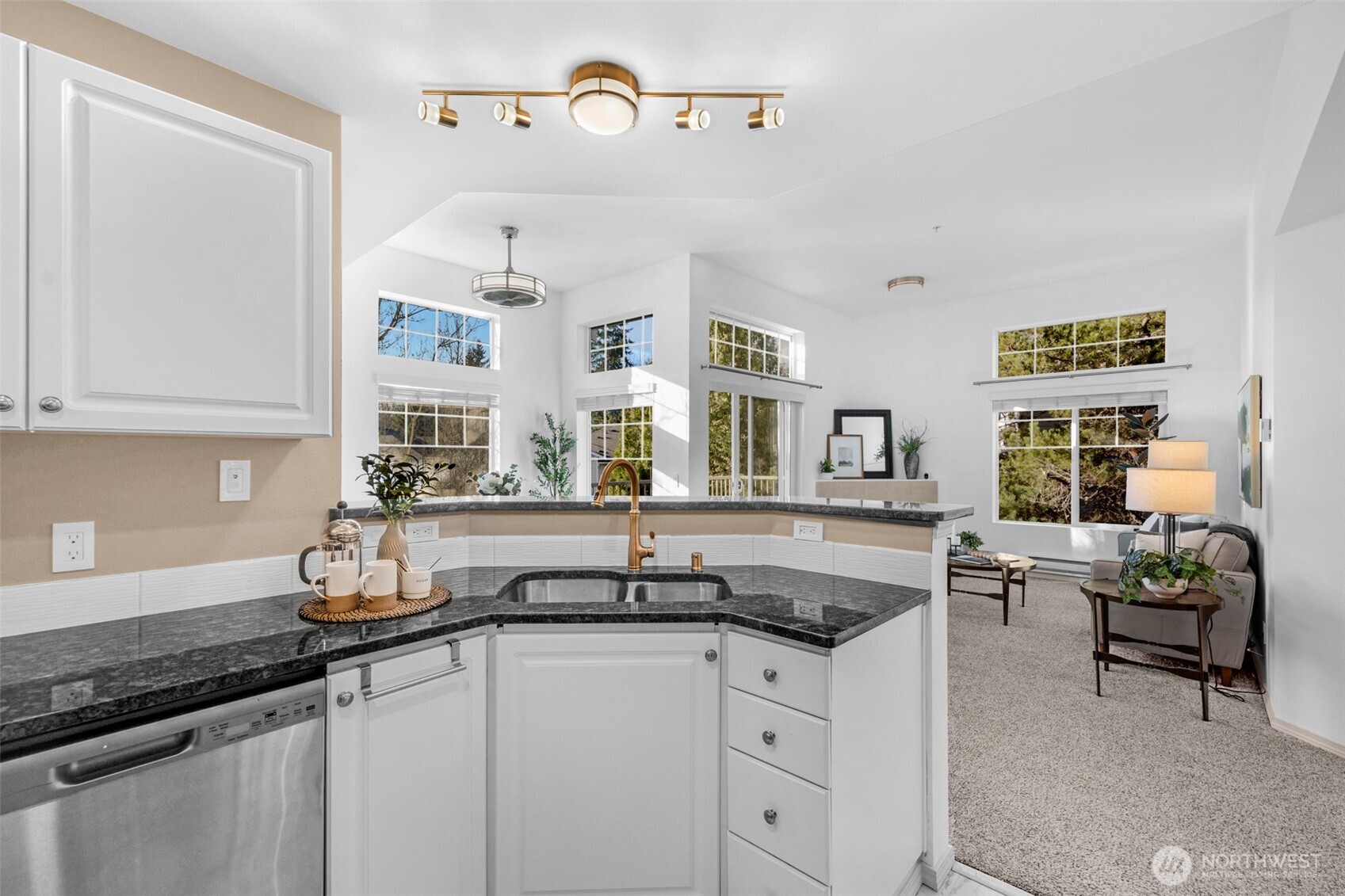 14007 69th Drive Southeast, Unit R2 Snohomish, WA 98296 - Photo 12 of 21 a kitchen with granite countertop a sink and cabinets