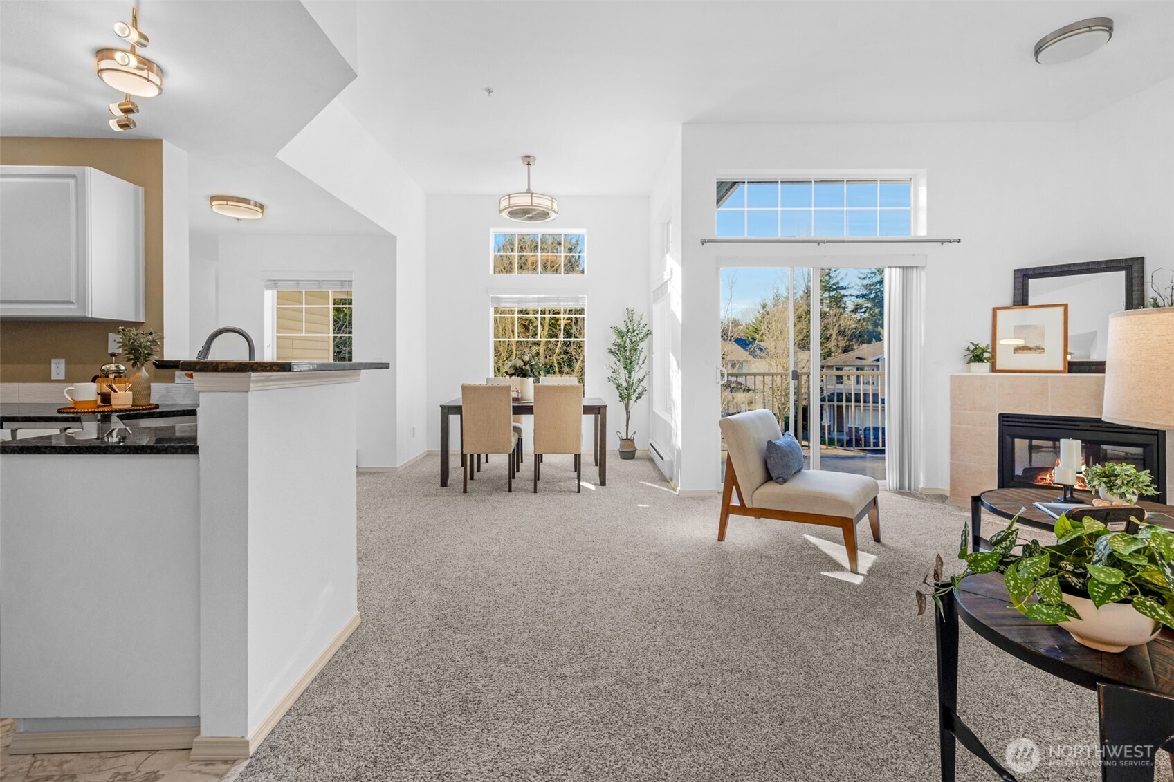 14007 69th Drive Southeast, Unit R2 Snohomish, WA 98296 - Photo 13 of 21 a living room with furniture and a dining table with kitchen view