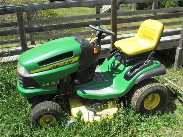 9501 Neils Branch Road Raleigh, NC 27603 - Photo 20 of 21 John Deere riding mower is included plus assorted power tools.
