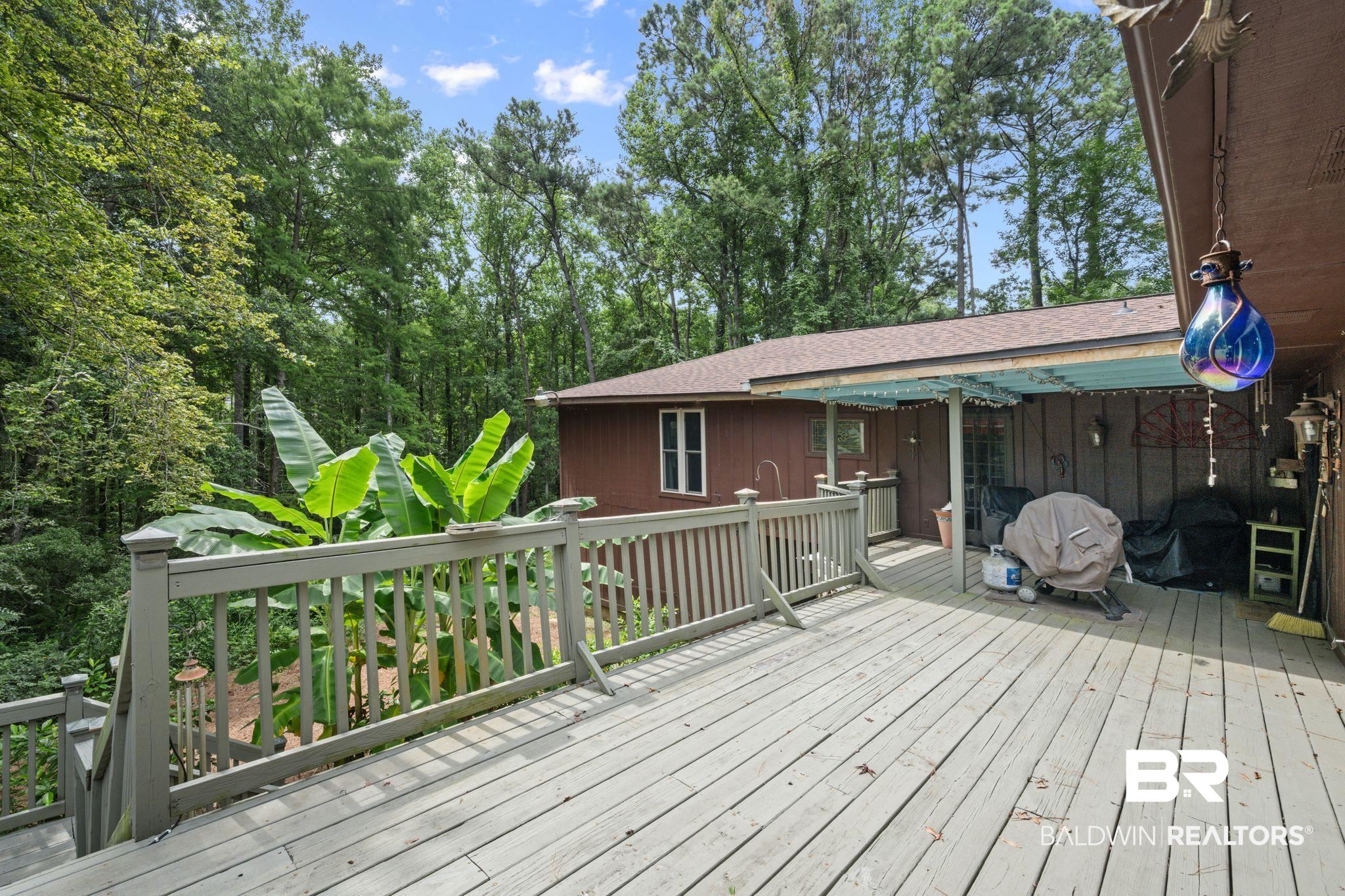 40 Caisson Trace Daphne, AL 36527 - Photo 37 of 54 Rear deck with covered seating area.