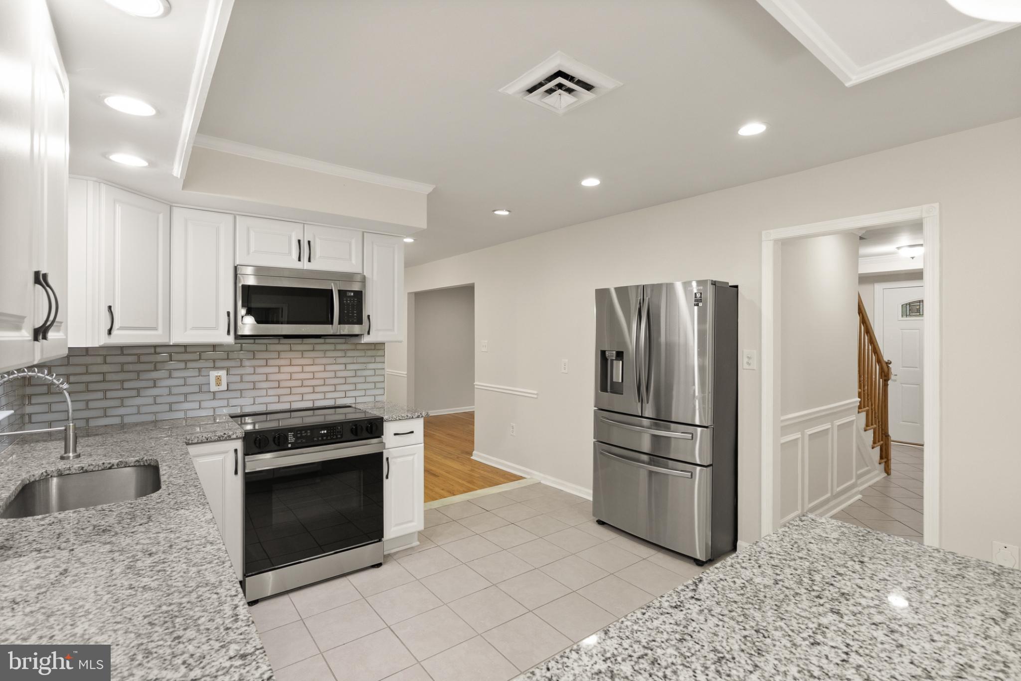 7075 Yates Ford Road Manassas, VA 20111 - Photo 17 of 54 Modern kitchen with sleek finishes.