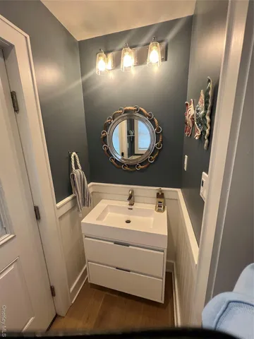 a spacious bedroom with a bed and a flat screen tv