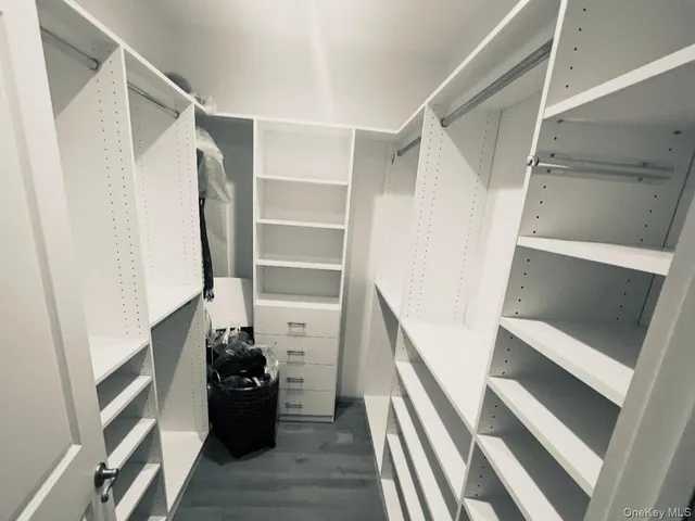 a view of balcony with wooden floor and fence