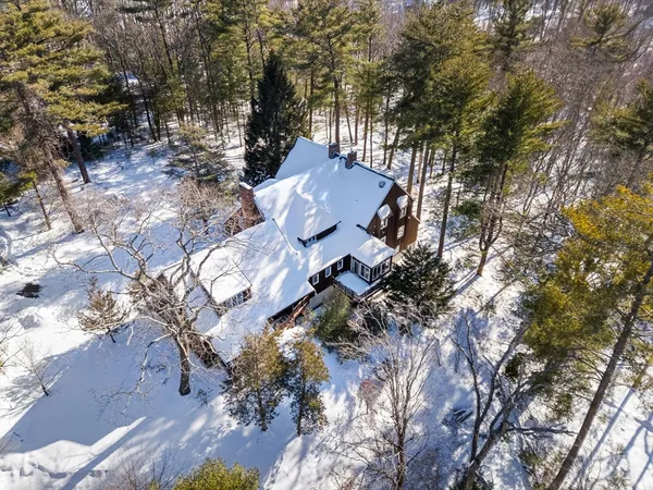 a view of house with yard and outdoor seating