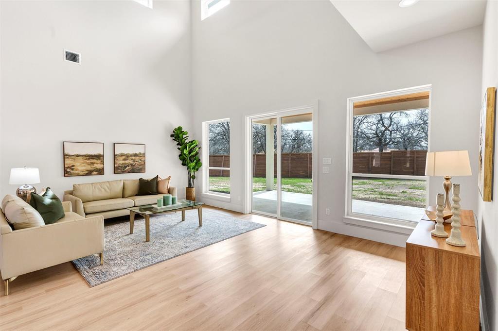 428 Squaw Creek Road Willow Park, TX 76087 - Photo 11 of 34 a living room with furniture and a large window