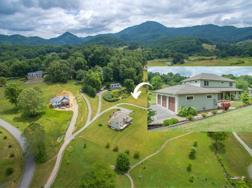 750 Iron Tree Drive Clyde, NC 28721 - Photo 1 of 40 a view of a swimming pool with a garden