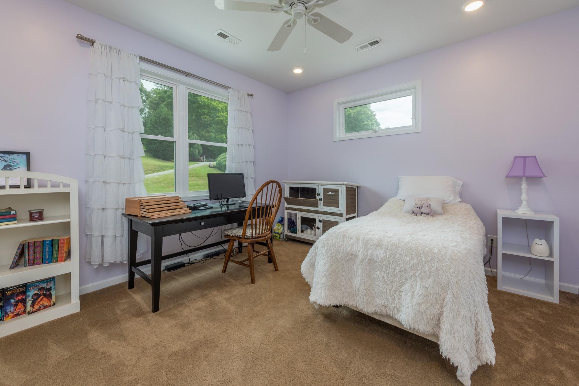 750 Iron Tree Drive Clyde, NC 28721 - Photo 11 of 40 a bedroom with furniture and a window