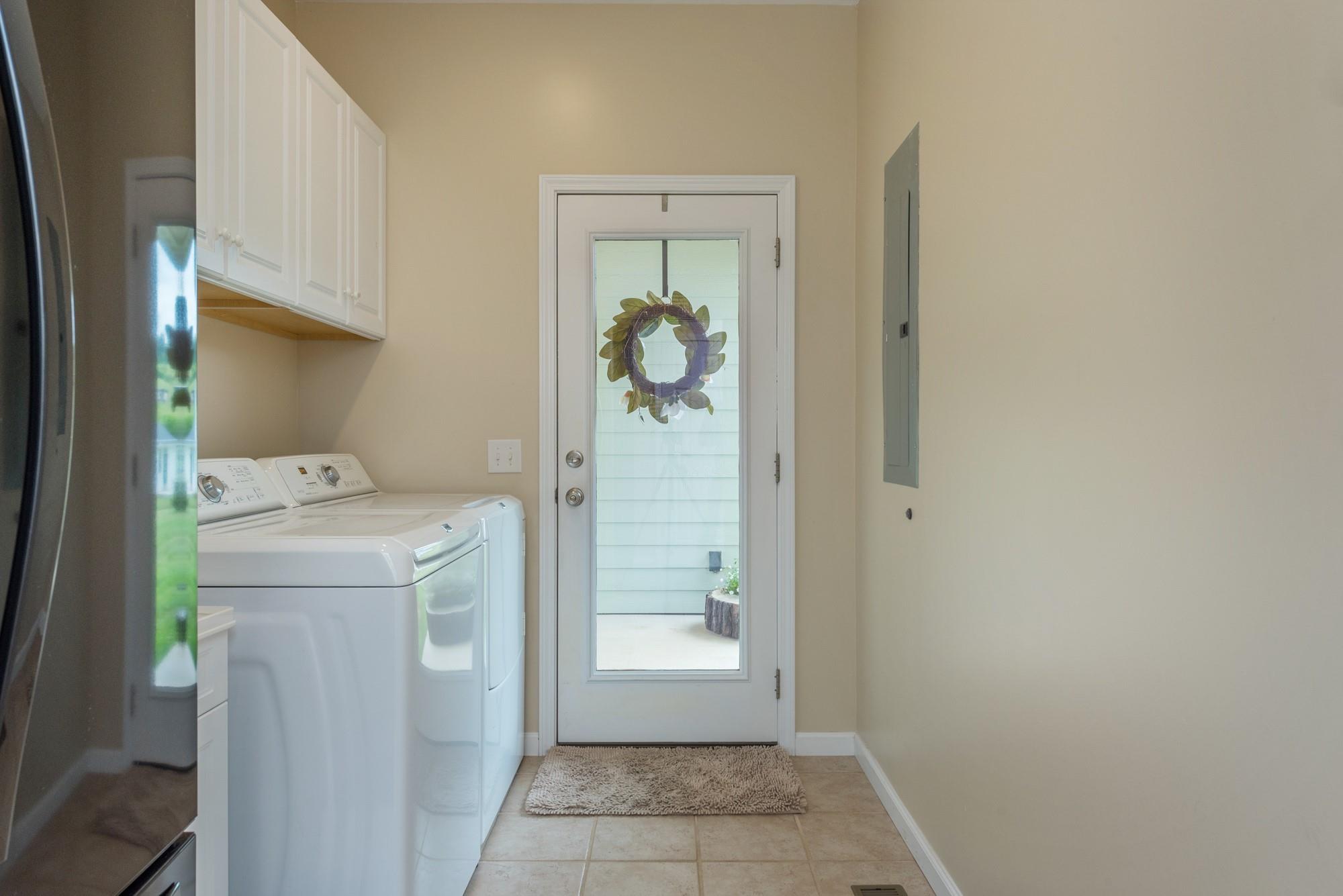 750 Iron Tree Drive Clyde, NC 28721 - Photo 14 of 40 a bathroom with a granite countertop sink and a mirror