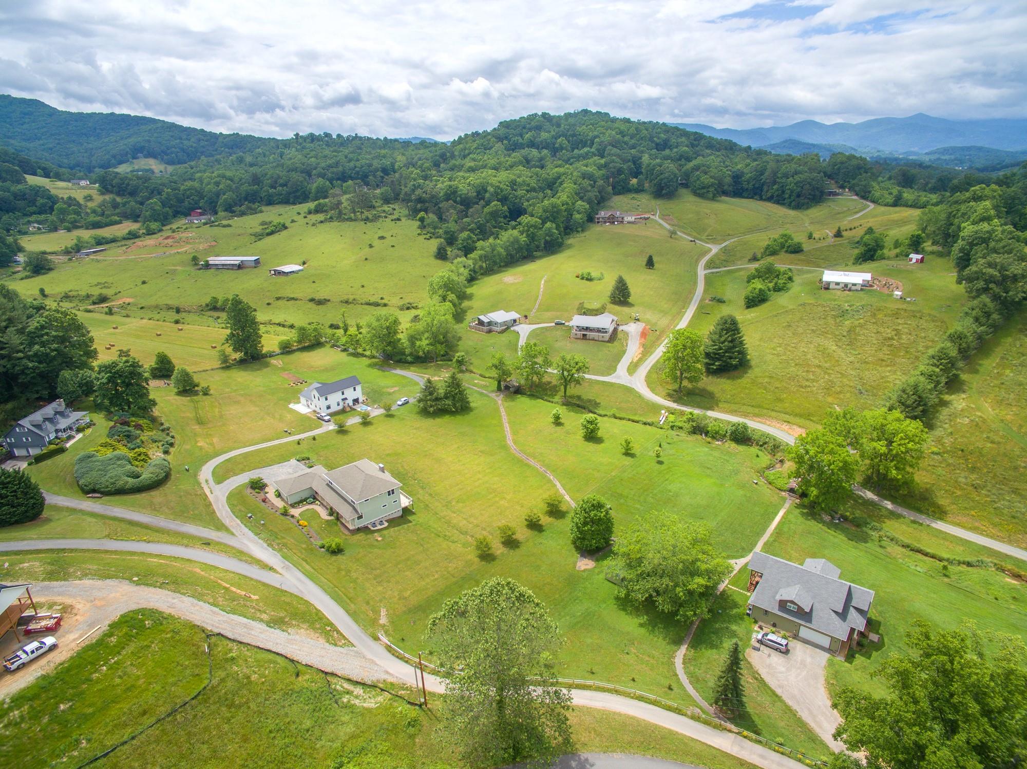 750 Iron Tree Drive Clyde, NC 28721 - Photo 15 of 40 an aerial view of residential houses with outdoor space