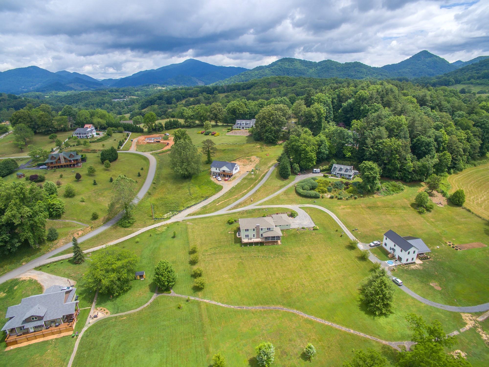 750 Iron Tree Drive Clyde, NC 28721 - Photo 17 of 40 a view of a swimming pool with a mountain