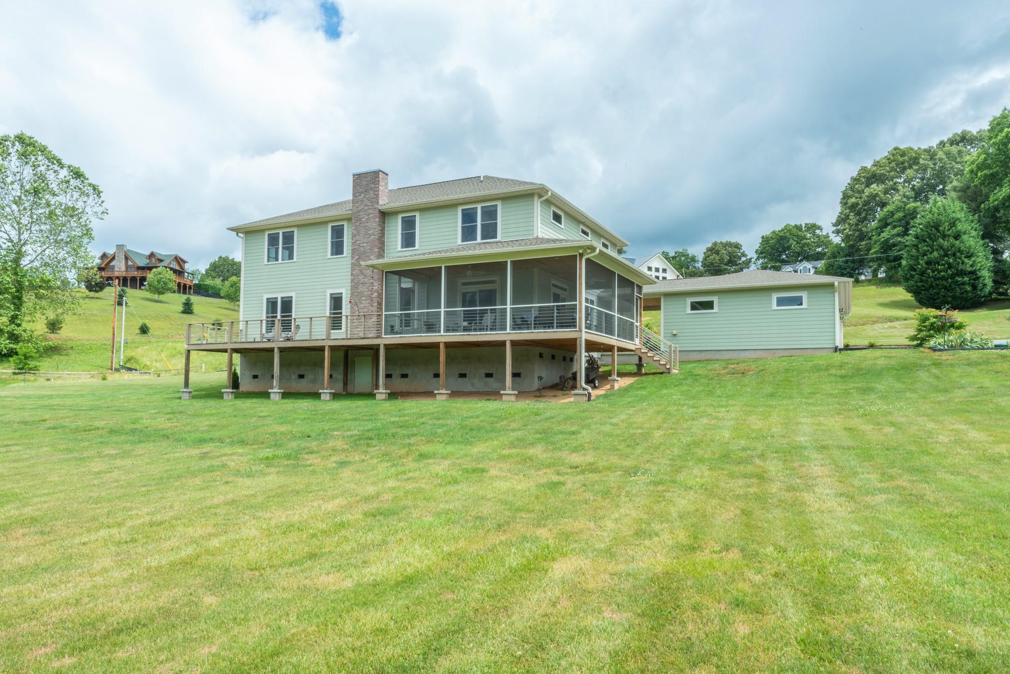 750 Iron Tree Drive Clyde, NC 28721 - Photo 23 of 40 a front view of a house with a garden