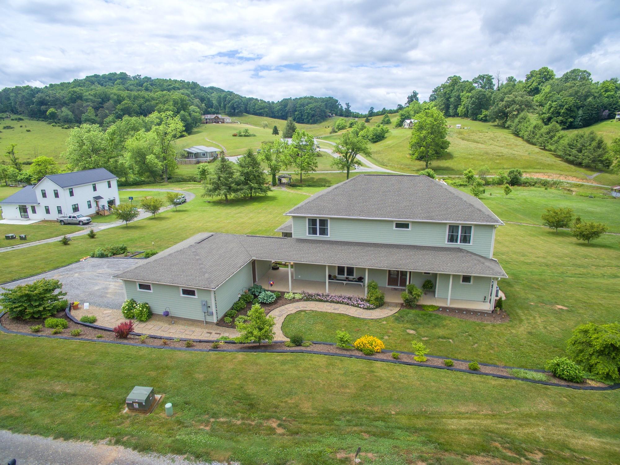 750 Iron Tree Drive Clyde, NC 28721 - Photo 24 of 40 an aerial view of a house with a garden