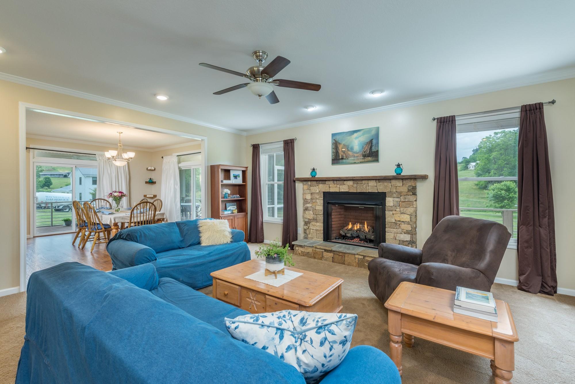 750 Iron Tree Drive Clyde, NC 28721 - Photo 27 of 40 a living room with furniture and a fireplace