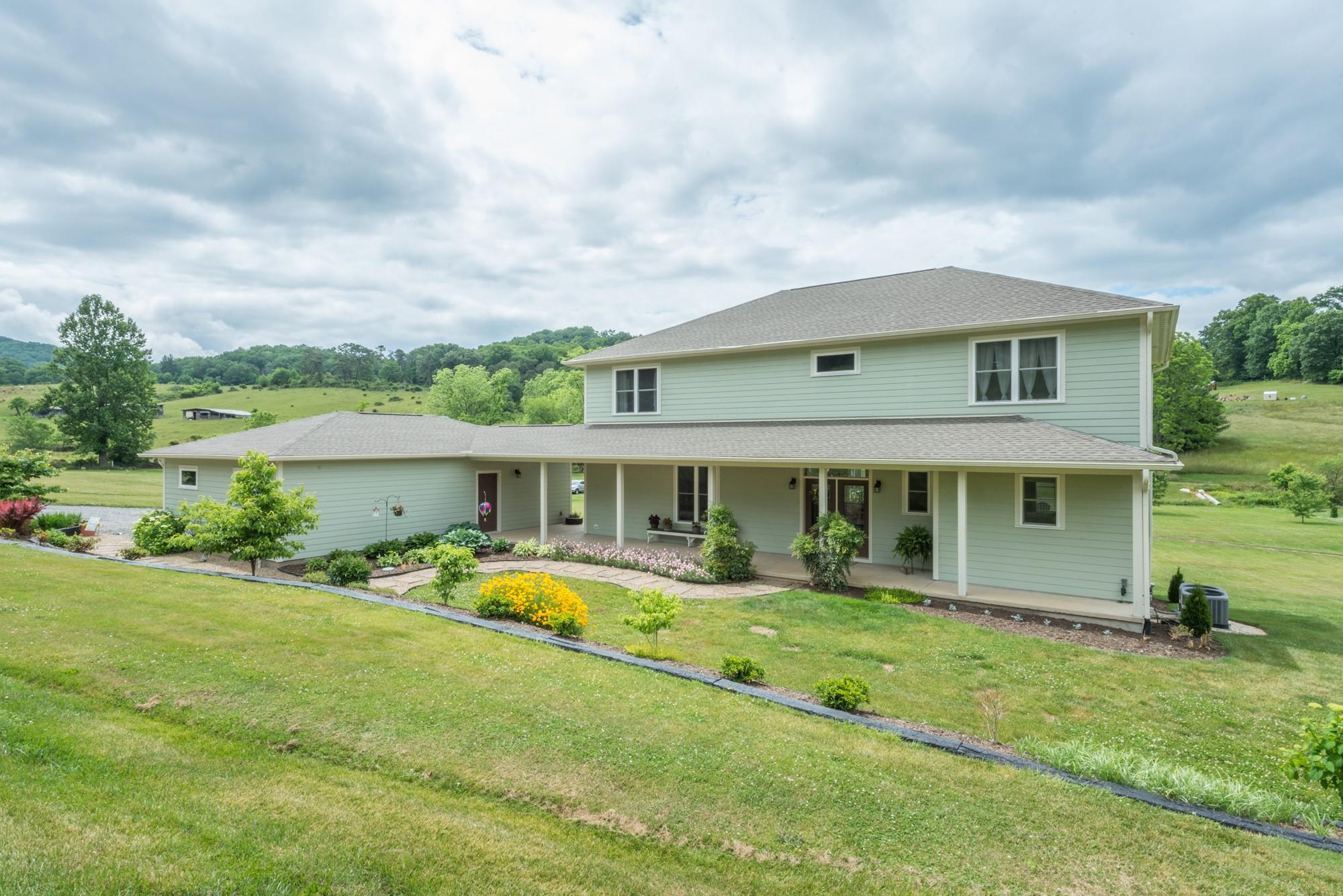 750 Iron Tree Drive Clyde, NC 28721 - Photo 39 of 40 a front view of a house with a yard