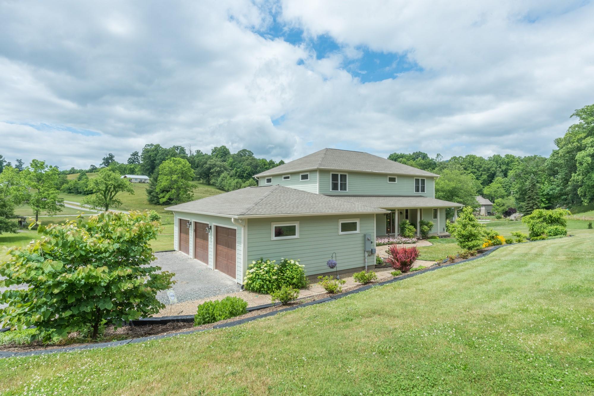 750 Iron Tree Drive Clyde, NC 28721 - Photo 40 of 40 a front view of a house with garden