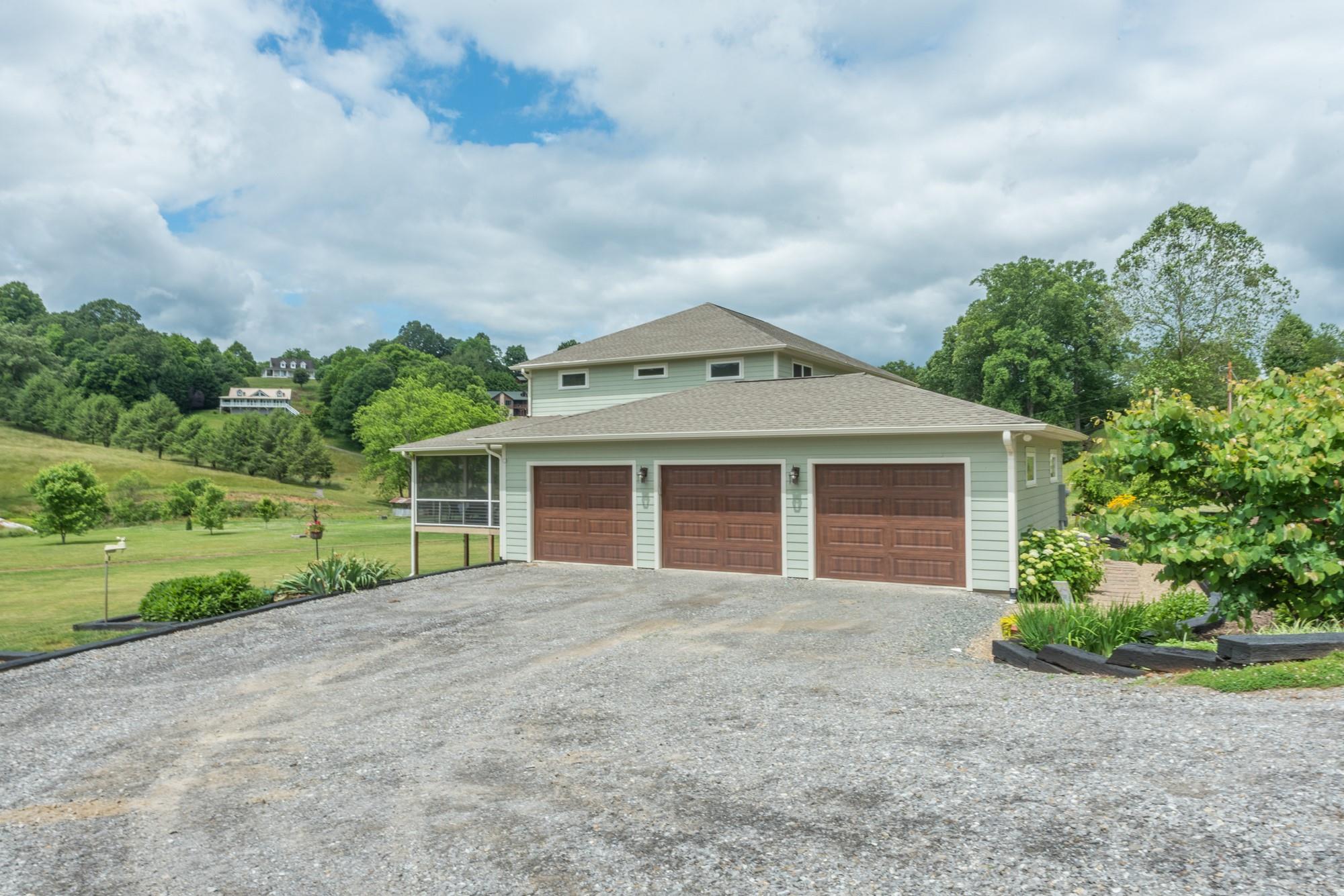 750 Iron Tree Drive Clyde, NC 28721 - Photo 7 of 40 front view of a house with a yard