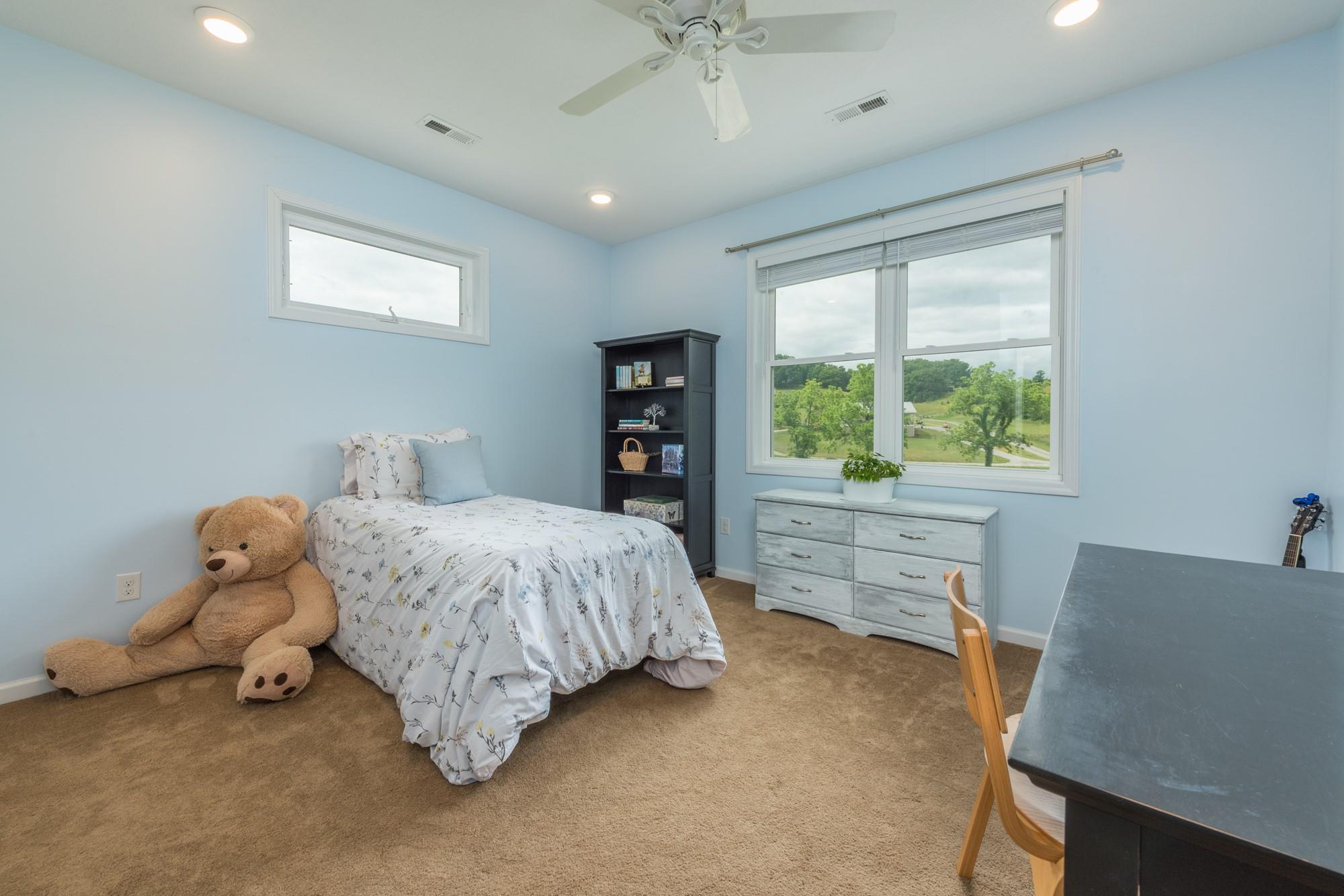 750 Iron Tree Drive Clyde, NC 28721 - Photo 9 of 40 a bedroom with a bed and a window