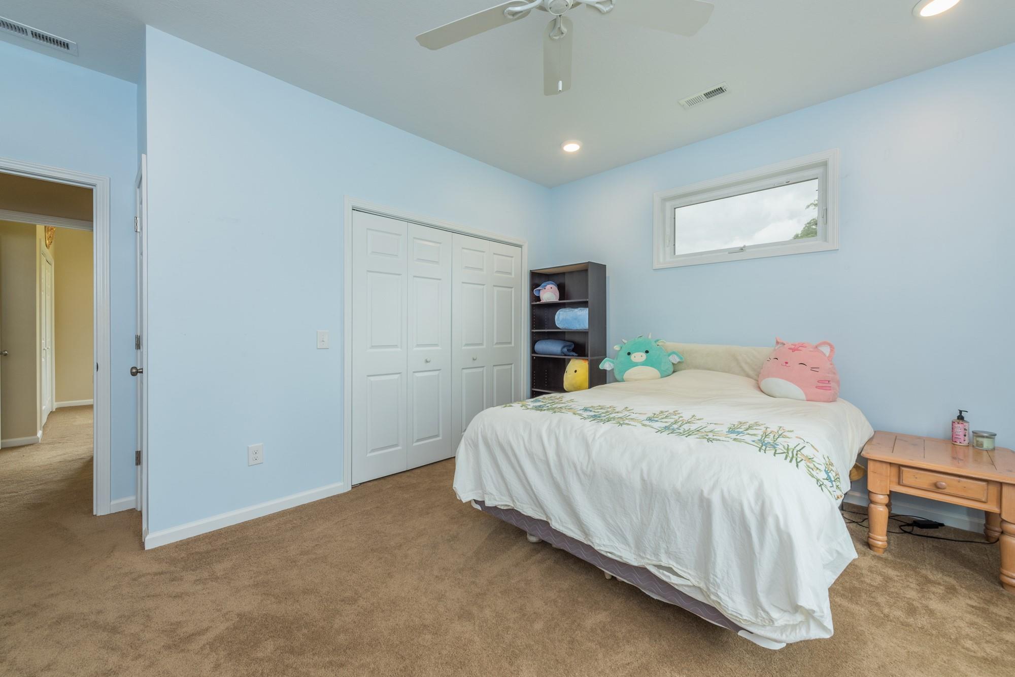 750 Iron Tree Drive Clyde, NC 28721 - Photo 10 of 40 a bedroom with a bed and a table
