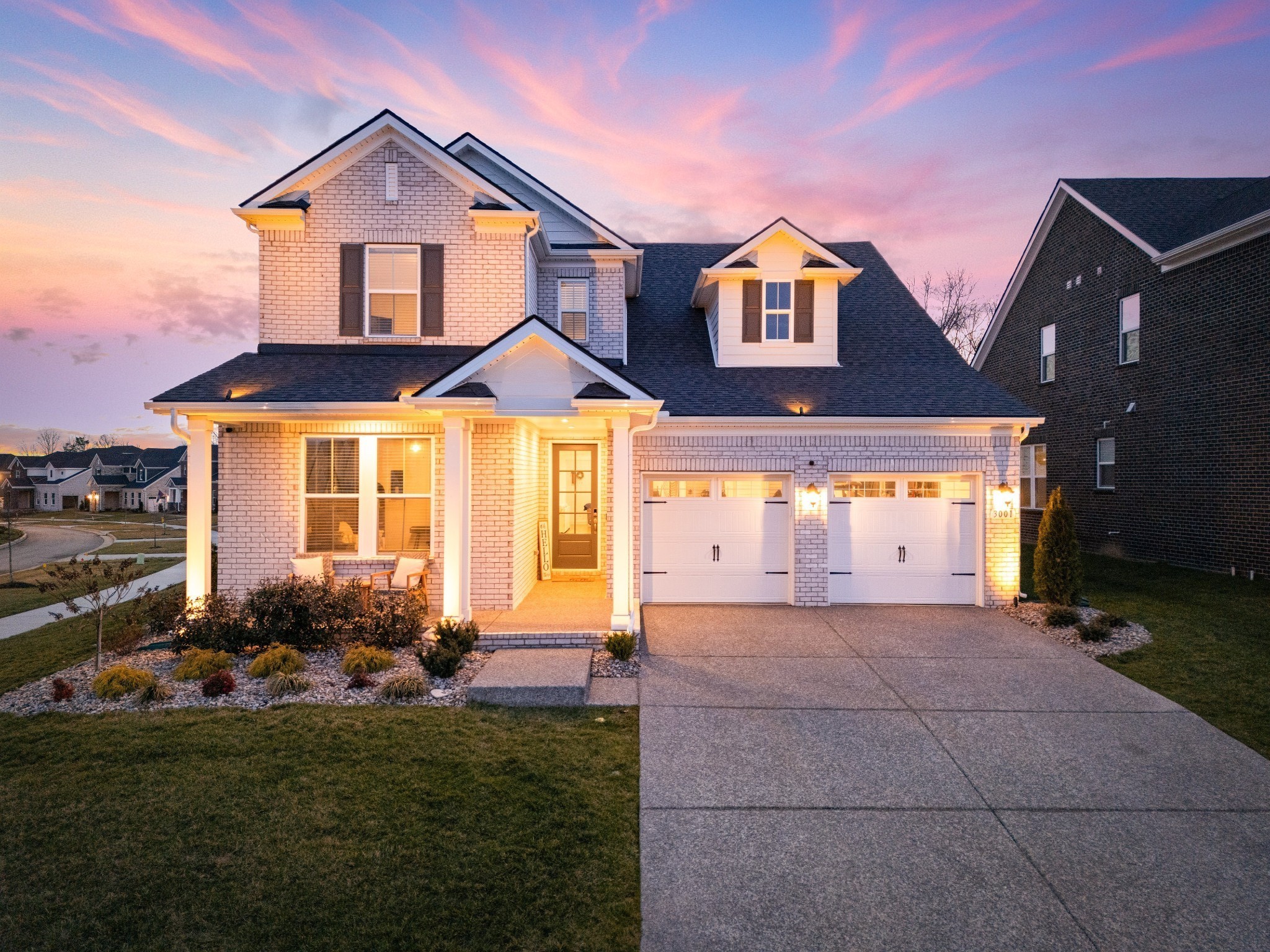 a front view of a house with garden