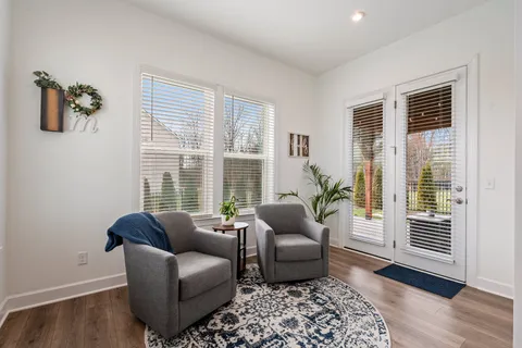 a living room with furniture and windows