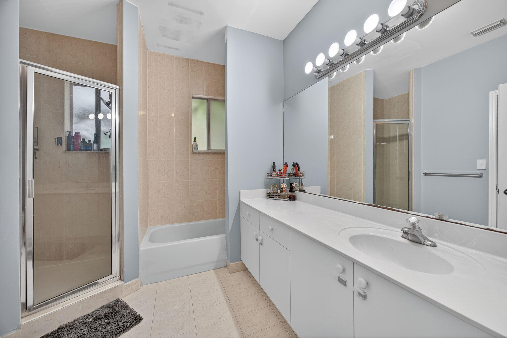 23125 Southwest 112th Court Miami, FL 33170 - Photo 14 of 24 a bathroom with a tub sink shower and mirror