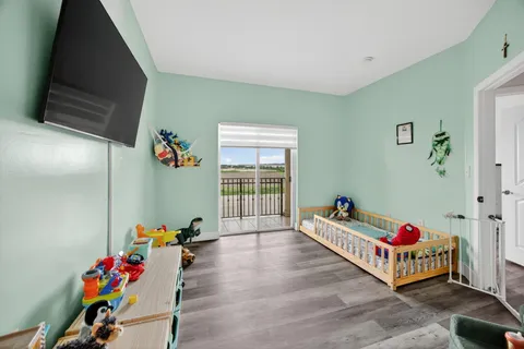 a room with toys and a wooden floor