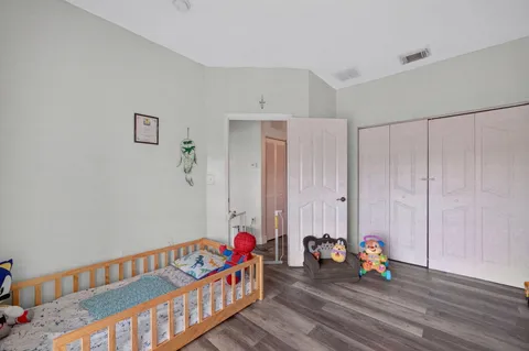 a view of a room with toys and wooden floor