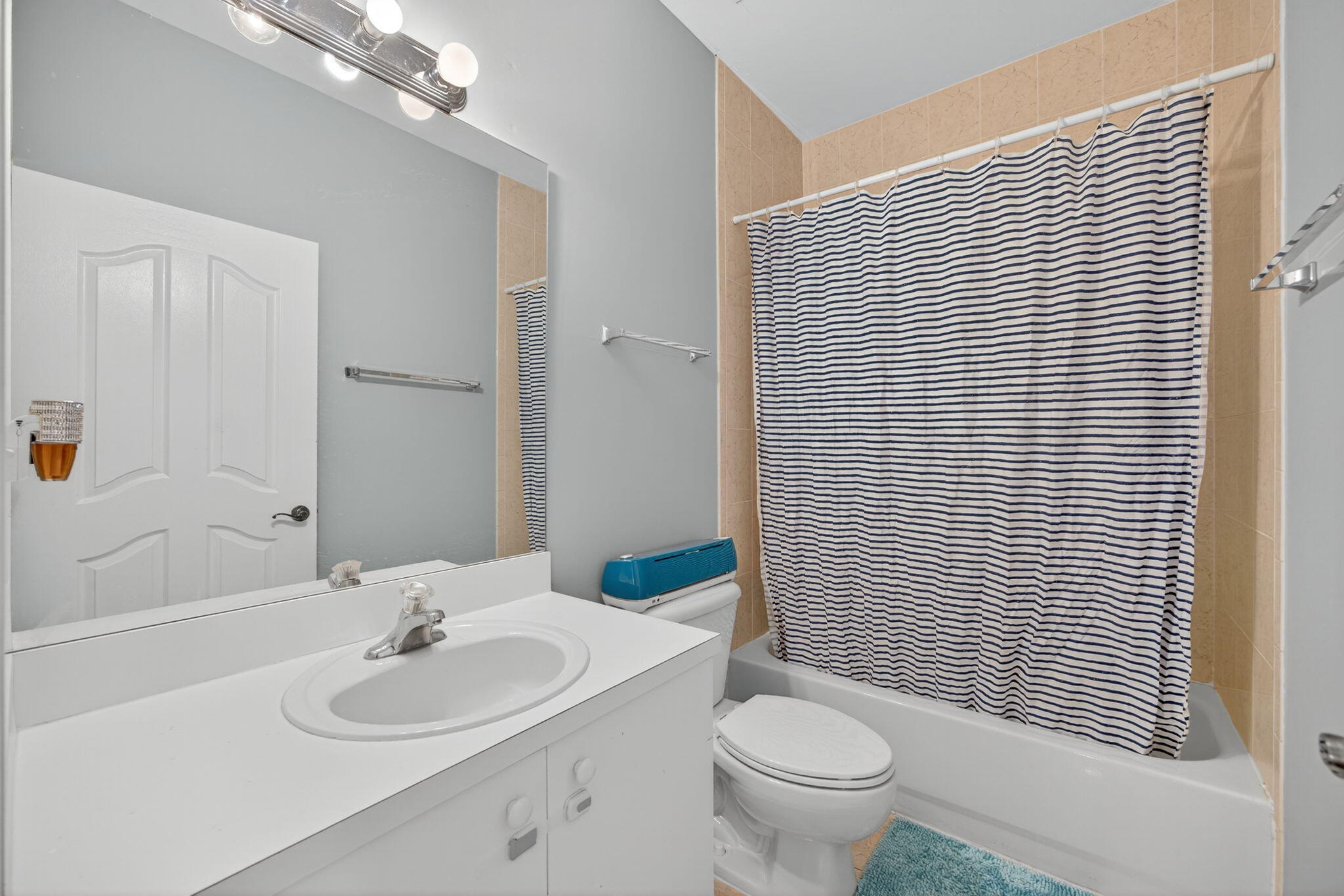 23125 Southwest 112th Court Miami, FL 33170 - Photo 20 of 24 a bathroom with a sink a toilet and shower curtain