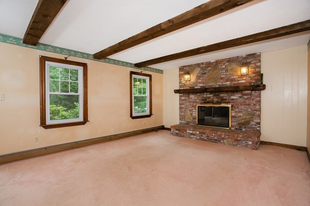 36 Morton Road Freetown, MA 02717 - Photo 21 of 40 an empty room with windows fire place and an outdoor space