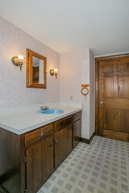 36 Morton Road Freetown, MA 02717 - Photo 34 of 40 a spacious bathroom with a sink a mirror and a shower