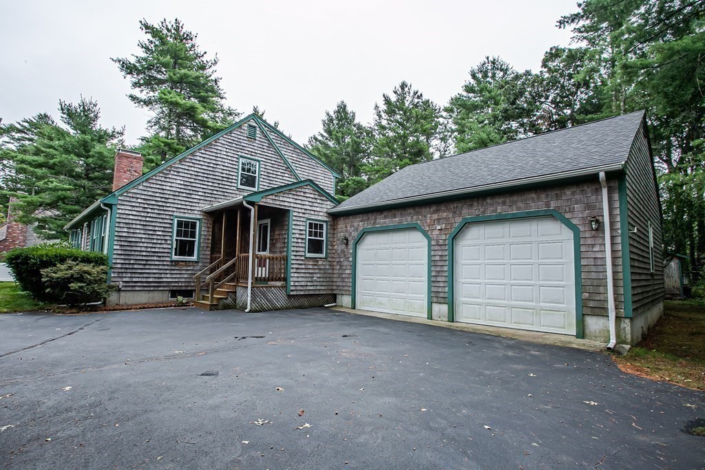 36 Morton Road Freetown, MA 02717 - Photo 6 of 40 a view of a house with a garage and a yard