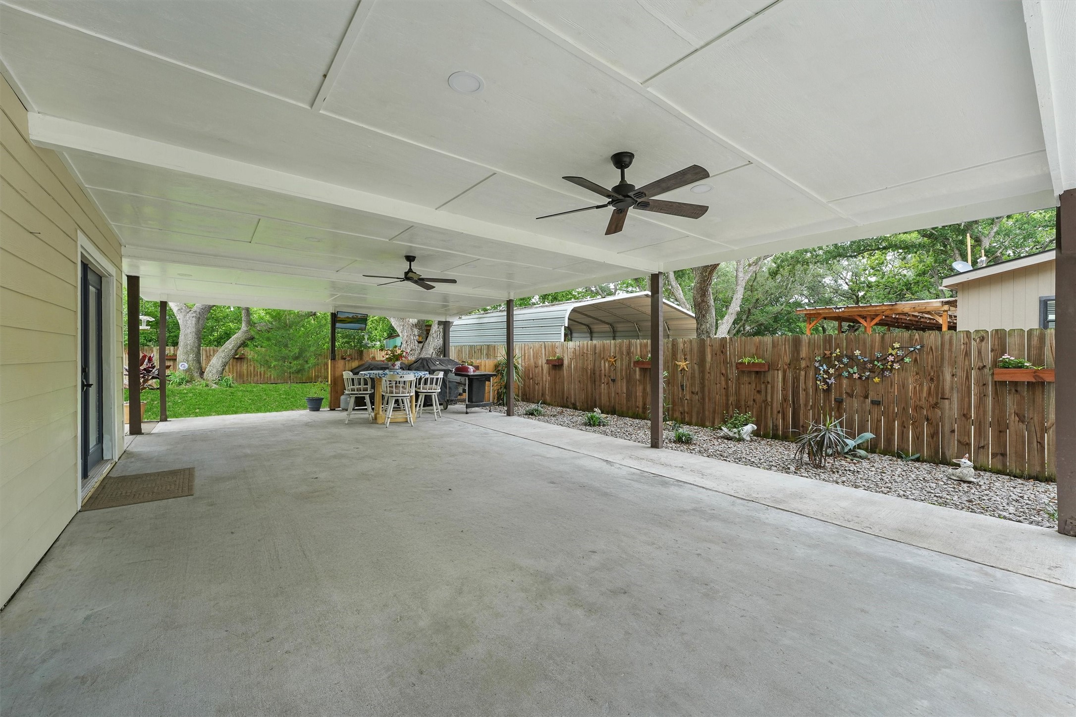 a view of a patio with table and chairs
