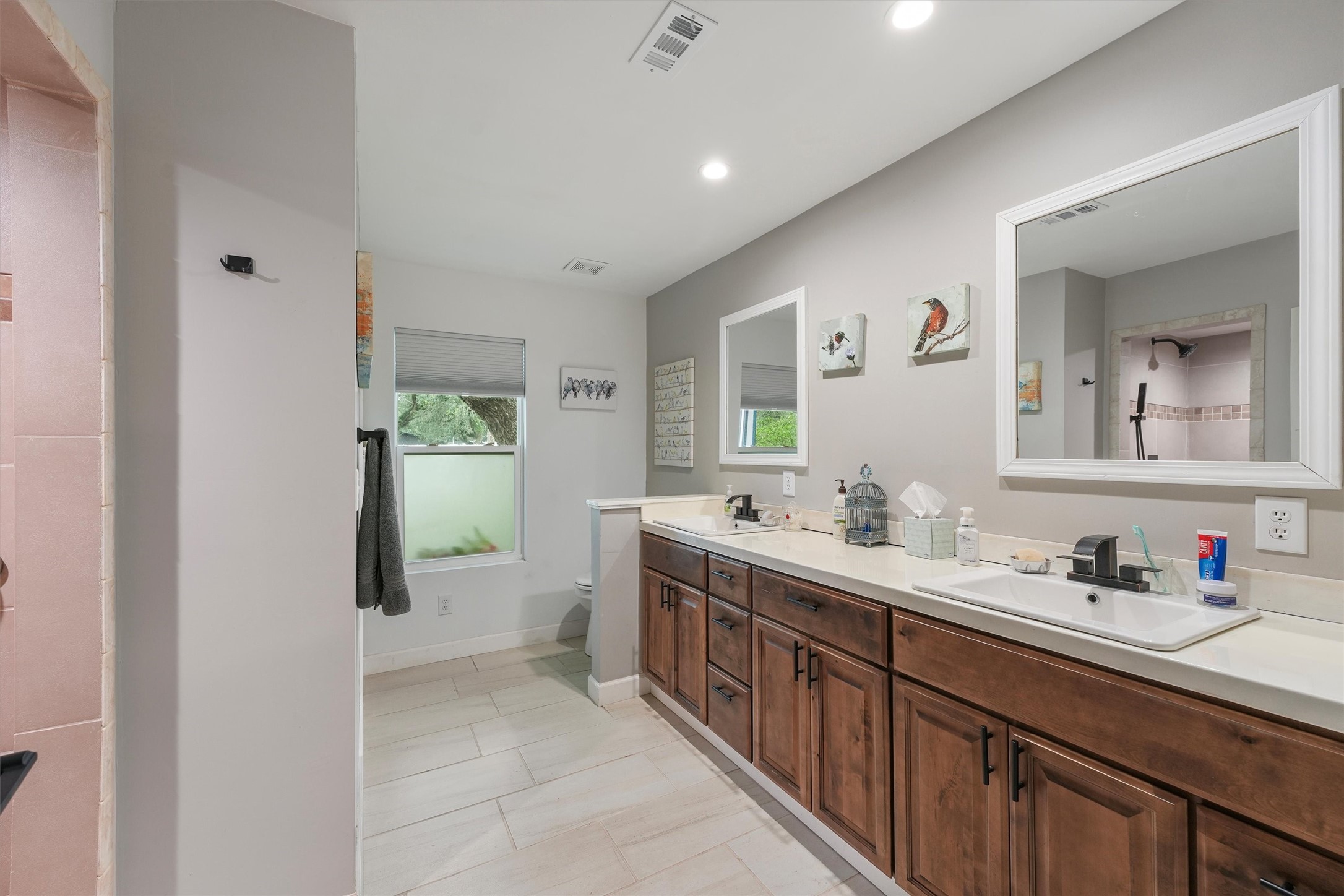 35 Bounty Palacios, TX 77465 - Photo 18 of 35 a spacious bathroom with a double vanity sink and a mirror